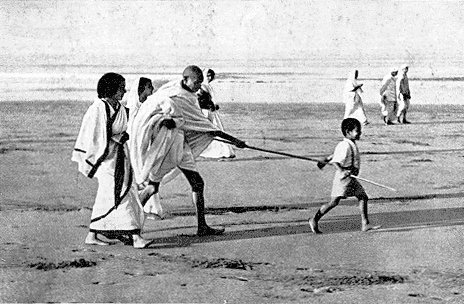 Boy Leads Gandhiji on Beach