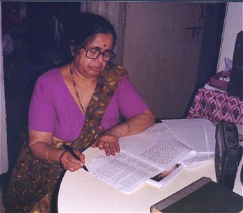 Jyotsna at work on the dinner table