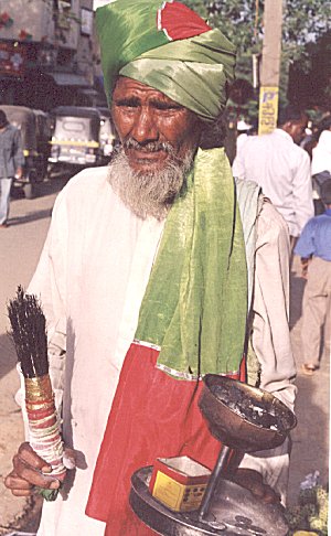 Beggar by choice: A Sufi fakir seeks alms on the street