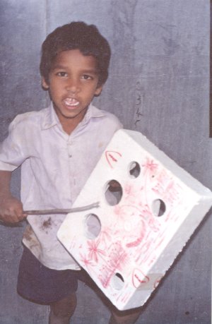 Boy Playing with Styrofoam