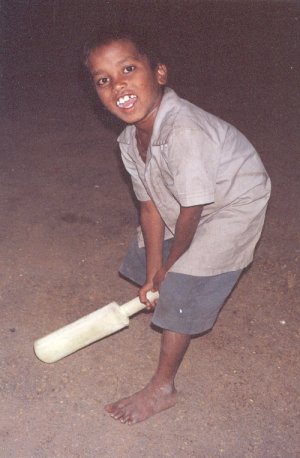 Boy Playing with a Plastic Cricket Bat