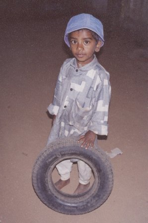 Boy Playing with a Wheel