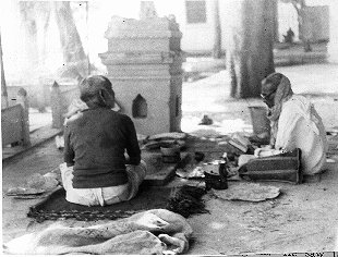 Men Praying in front of Tulasi