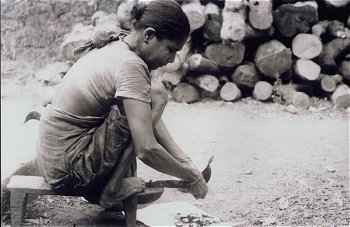 Woman Operates a Addoli (Stationary Knife)