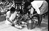 Serving food at a Munji feast, 1982