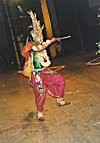 Chhau Dancer Shooting an Arrow During Performance