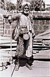 Beggar with Drums Outside a Temple